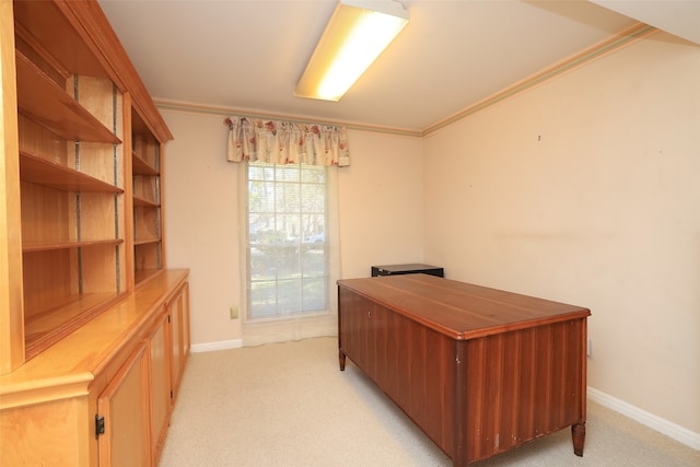 home office featuring crown molding and light colored carpet