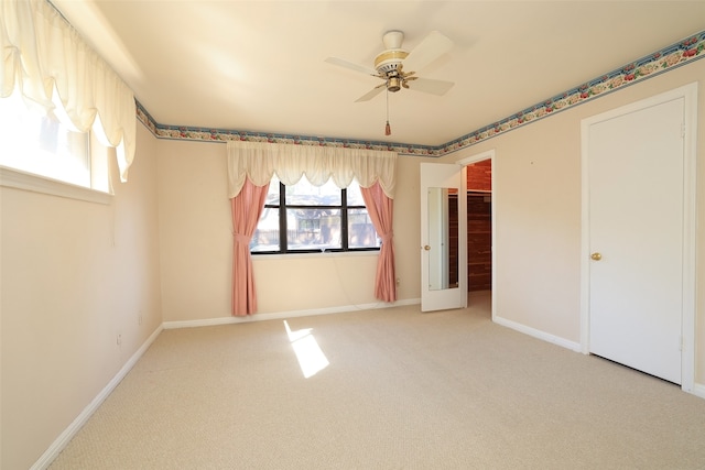 unfurnished bedroom with ceiling fan and carpet floors