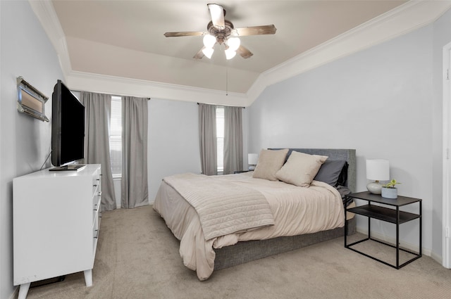 carpeted bedroom featuring ceiling fan and crown molding