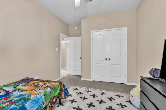 bedroom featuring ceiling fan, a closet, and concrete floors