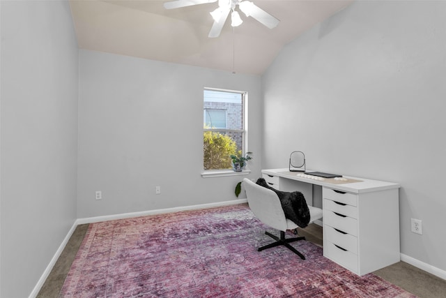 carpeted home office featuring ceiling fan and vaulted ceiling