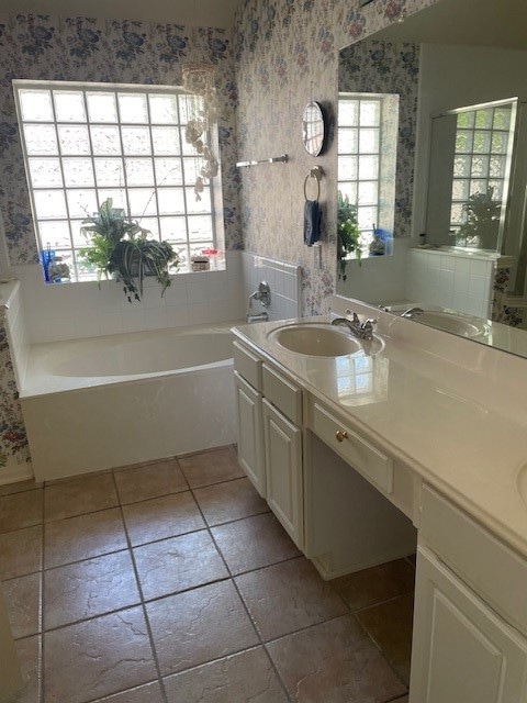 bathroom with a bathtub and vanity