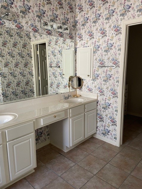 bathroom featuring tile patterned flooring and vanity