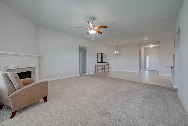 carpeted living room featuring ceiling fan