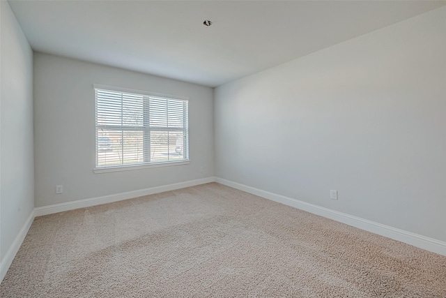 unfurnished room featuring carpet flooring