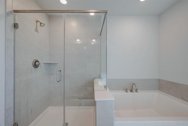 bathroom featuring plus walk in shower