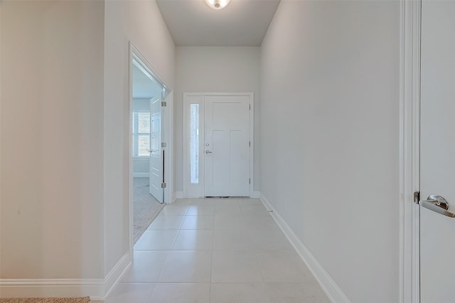 entryway with light tile patterned flooring