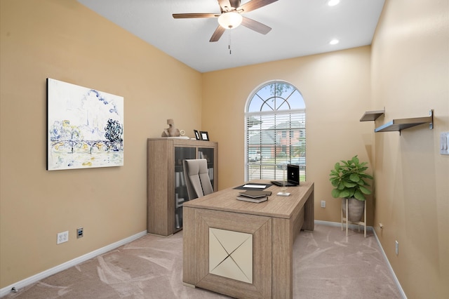 carpeted office featuring ceiling fan