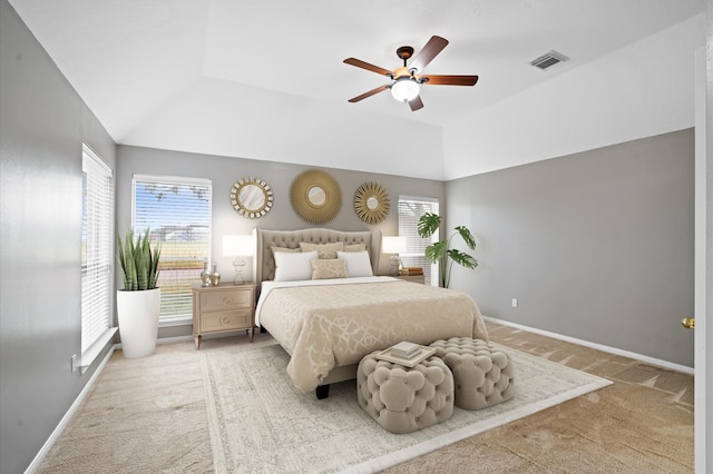 bedroom featuring ceiling fan, carpet floors, and vaulted ceiling