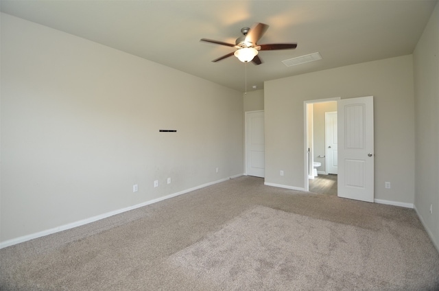 carpeted spare room with ceiling fan