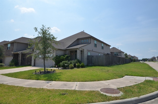 view of front property featuring a front yard and a garage