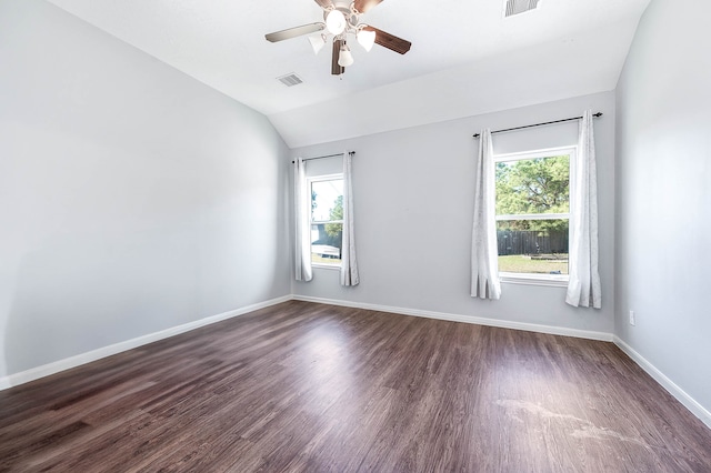 unfurnished room with ceiling fan, a healthy amount of sunlight, lofted ceiling, and dark wood-type flooring