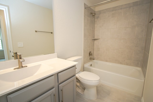 full bathroom with tile patterned flooring, vanity, toilet, and tiled shower / bath