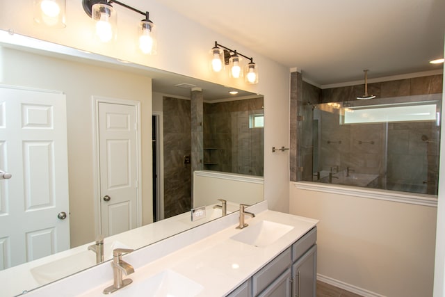 bathroom featuring vanity and tiled shower