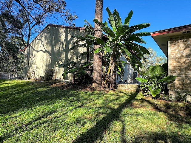 view of property exterior with a lawn