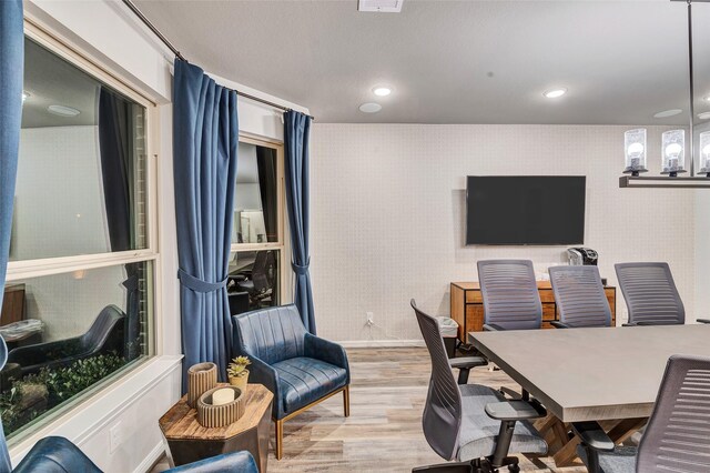 home office with light hardwood / wood-style floors