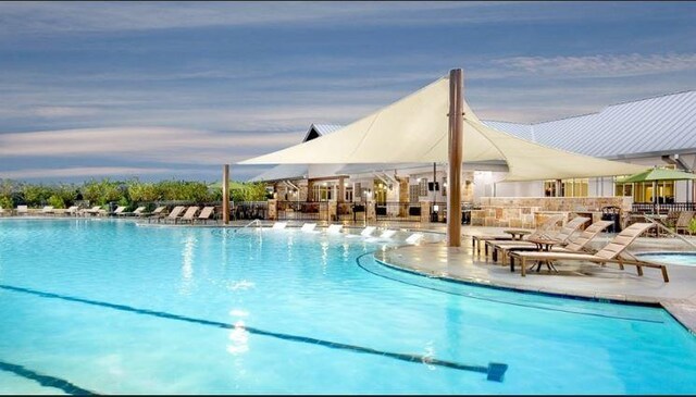 view of pool featuring a patio