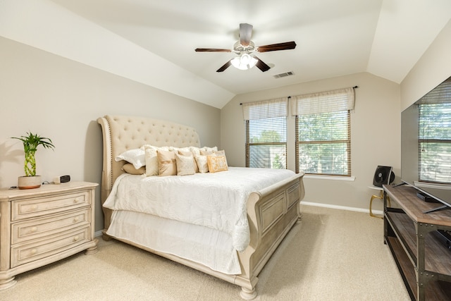 carpeted bedroom with vaulted ceiling and ceiling fan