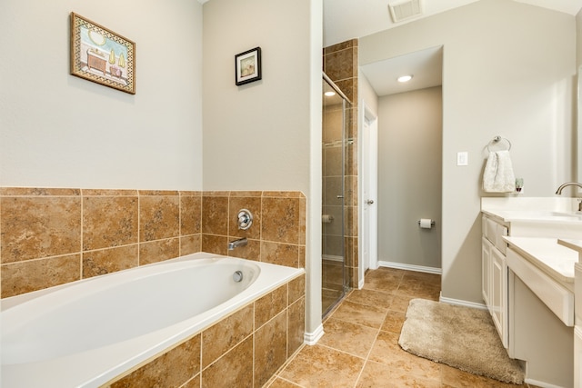 bathroom with tile patterned flooring, vanity, and shower with separate bathtub