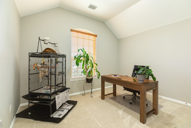 home office with carpet flooring and lofted ceiling