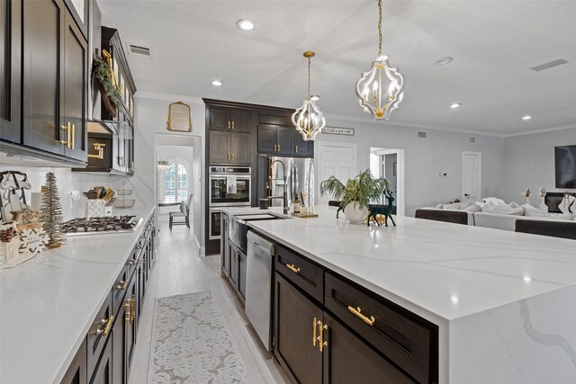 kitchen featuring a spacious island, tasteful backsplash, decorative light fixtures, light hardwood / wood-style floors, and stainless steel appliances