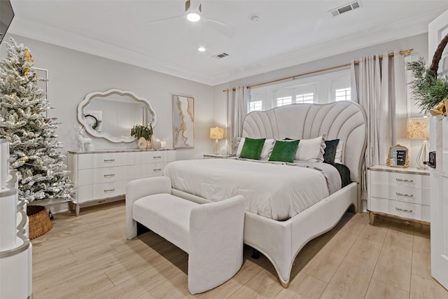 bedroom with ceiling fan, light hardwood / wood-style flooring, and crown molding