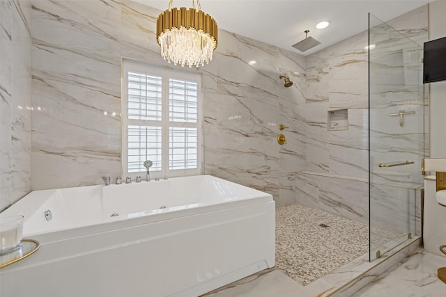 bathroom with a notable chandelier, tile walls, and independent shower and bath