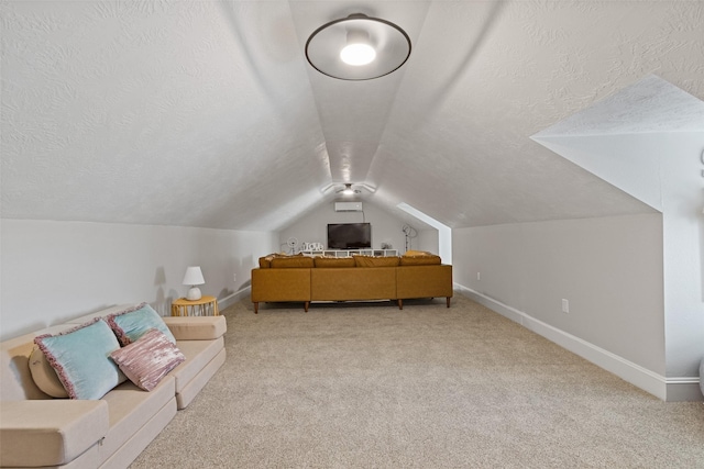 bonus room with a textured ceiling, light colored carpet, and lofted ceiling