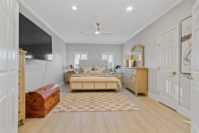 bedroom featuring ceiling fan, light hardwood / wood-style floors, and ornamental molding