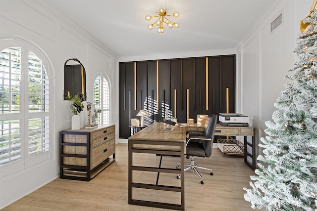 office area featuring a notable chandelier, ornamental molding, and light hardwood / wood-style flooring