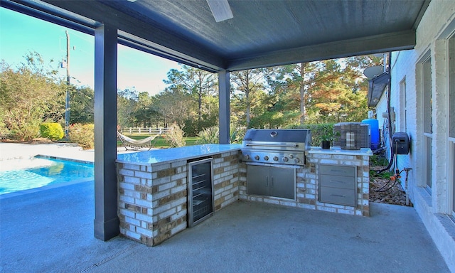 view of patio / terrace with area for grilling, beverage cooler, and grilling area