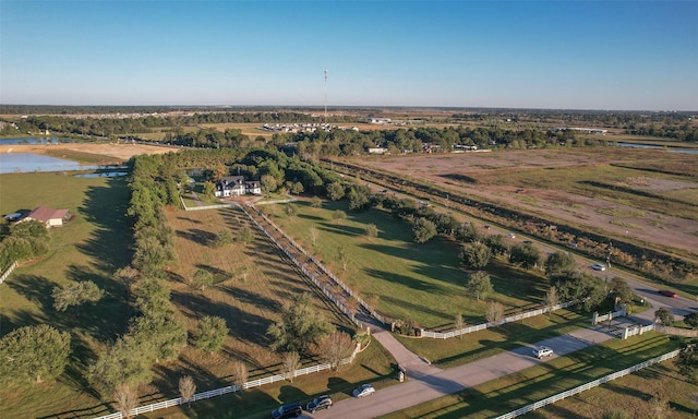 birds eye view of property with a water view and a rural view