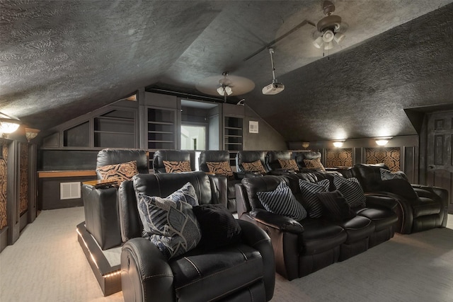 carpeted home theater room with vaulted ceiling, ceiling fan, wood walls, and a textured ceiling