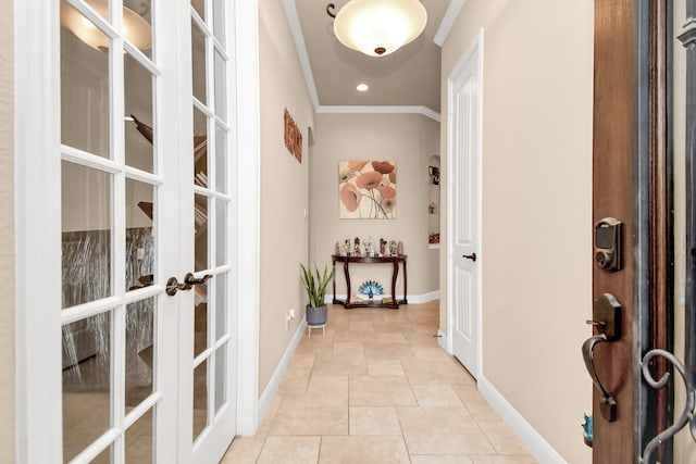 hall featuring french doors, light tile patterned floors, and crown molding