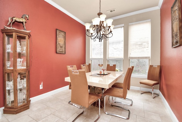 dining space with a notable chandelier, light tile patterned flooring, and ornamental molding