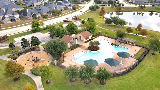 birds eye view of property with a water view