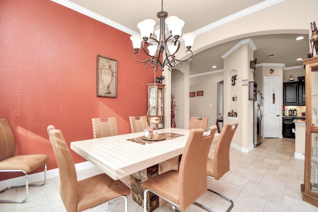 tiled dining area with crown molding and a chandelier