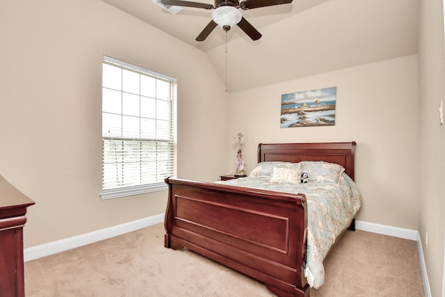 bedroom featuring ceiling fan, light colored carpet, and vaulted ceiling