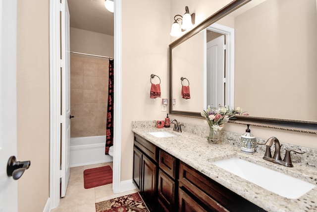 bathroom featuring tile patterned flooring, vanity, and shower / bath combination with curtain