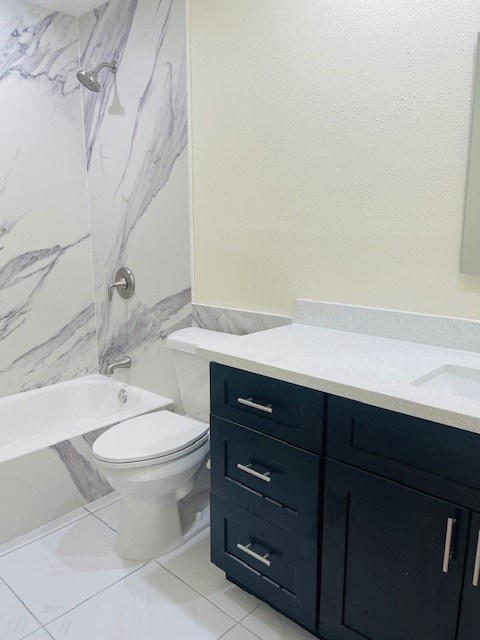 full bathroom featuring vanity, toilet, and tiled shower / bath combo