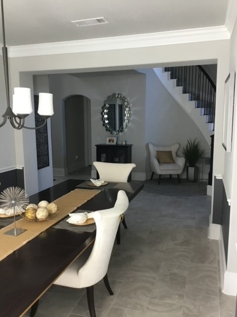 dining room featuring crown molding