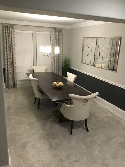 dining space with a notable chandelier