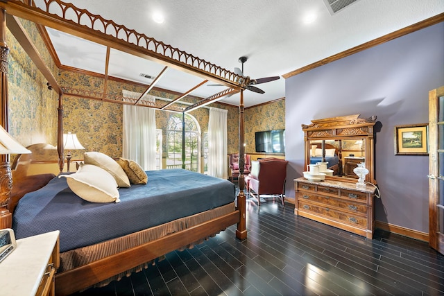 bedroom featuring ceiling fan, dark wood-type flooring, a textured ceiling, and ornamental molding