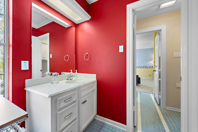 bathroom with vanity and ornamental molding