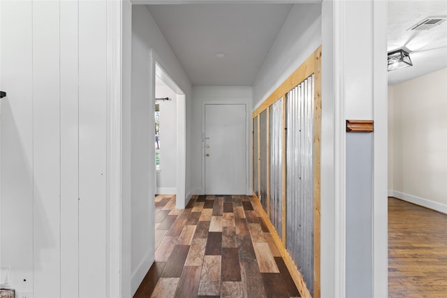 corridor with dark hardwood / wood-style floors