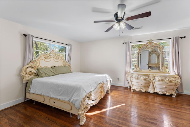 bedroom with ceiling fan and dark hardwood / wood-style floors