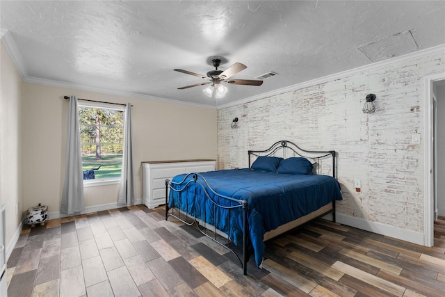 bedroom featuring crown molding, dark hardwood / wood-style floors, ceiling fan, and a textured ceiling