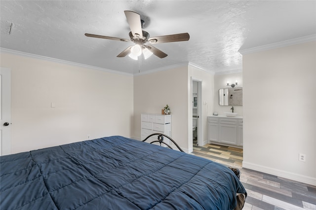 bedroom with ensuite bathroom, a textured ceiling, ceiling fan, crown molding, and light hardwood / wood-style flooring