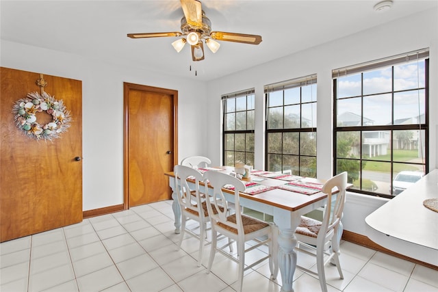 dining room with light tile patterned floors and a wealth of natural light