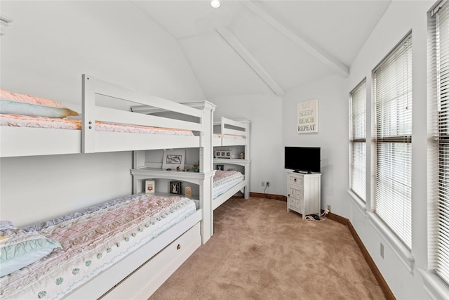 bedroom with vaulted ceiling, baseboards, and light colored carpet